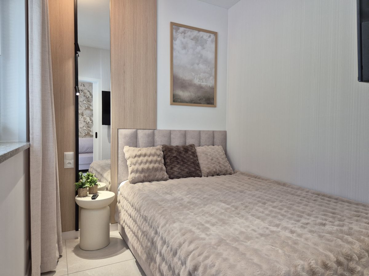 Sypialnia w apartamencie Heaven