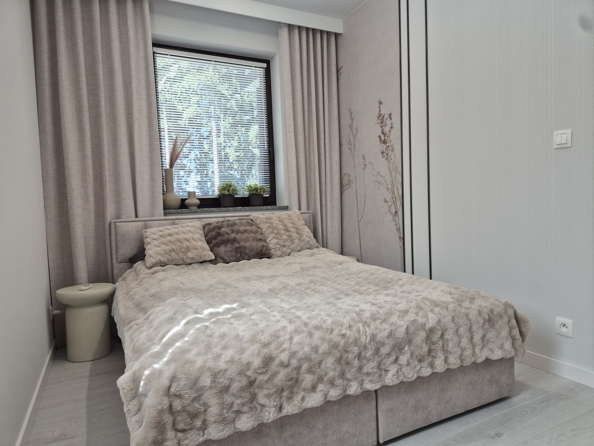 Sypialnia w apartamencie Heaven